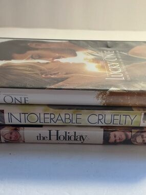 Three Romance DVD’s- Intolerable Cruelty,   The Holiday,  Lucky One